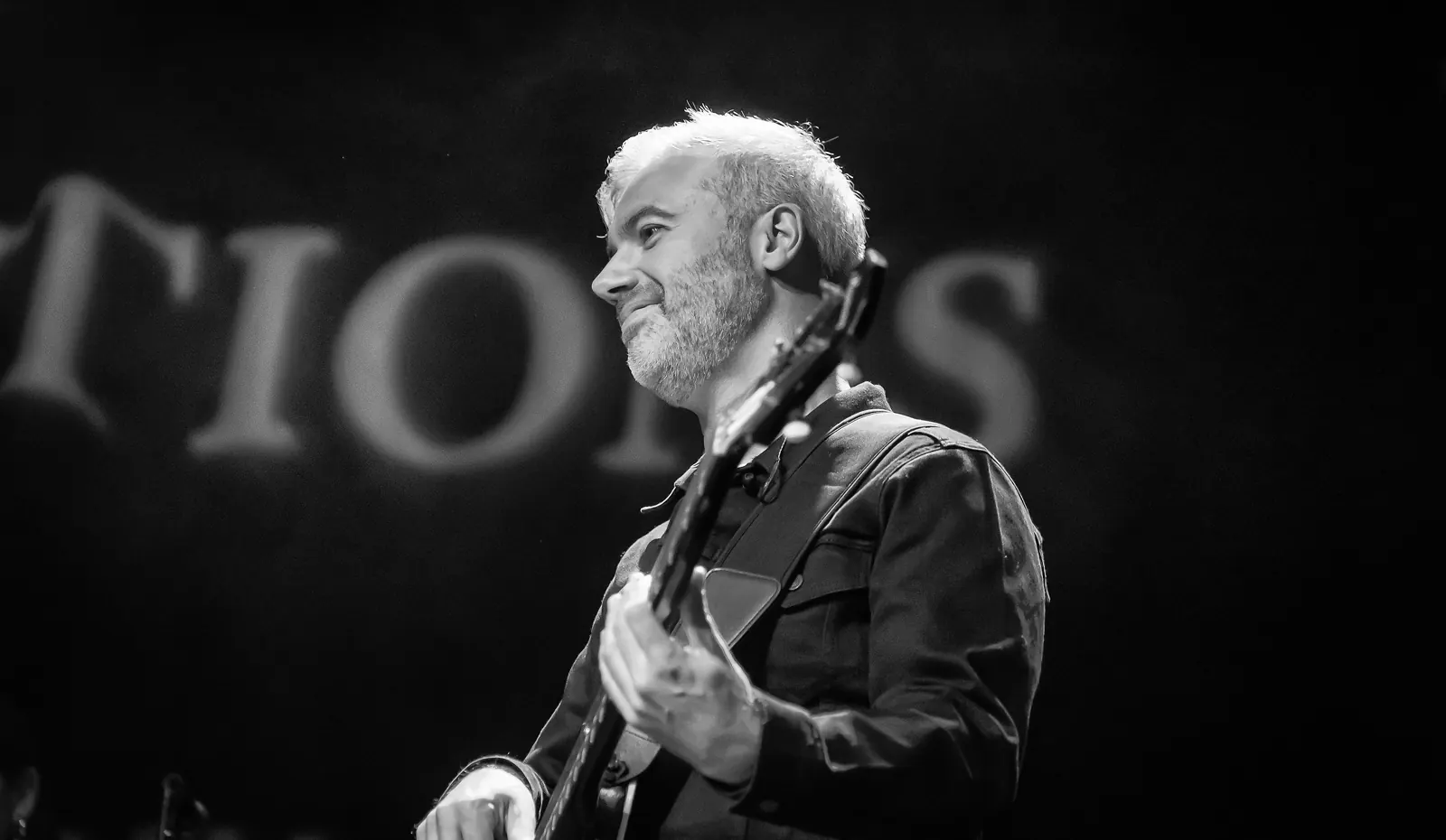 Euan Burton playing bass on stage at Celtic Connections